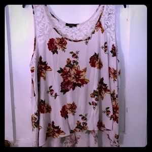 White tank with floral detail.